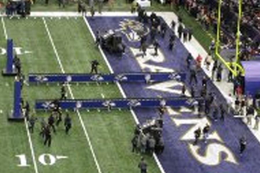 MHS band teacher Mr. Shearer watches as the Ravens come out of the tunnel. 