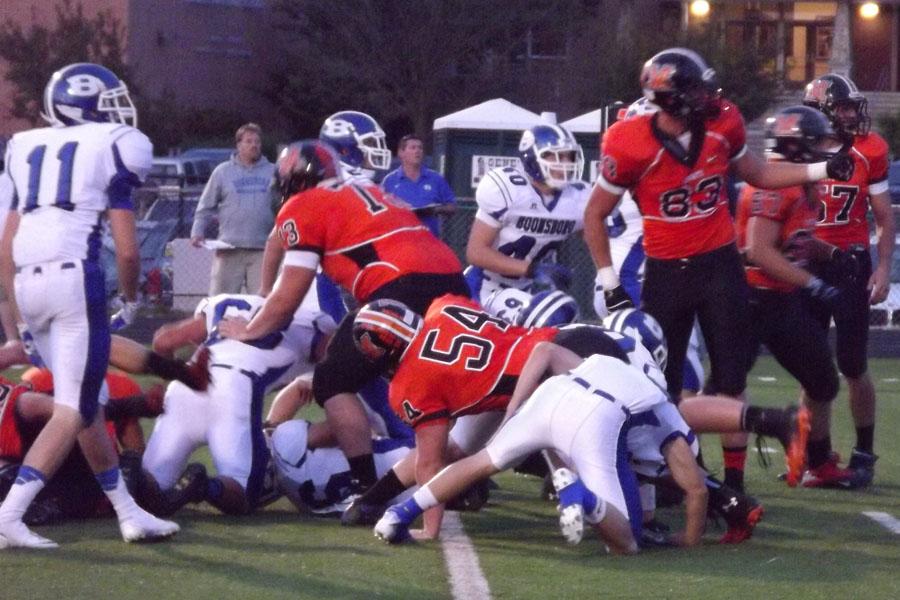 Middletown Knights varsity football players go after the ball in their game against Boonsboro High School on Sept. 20. 