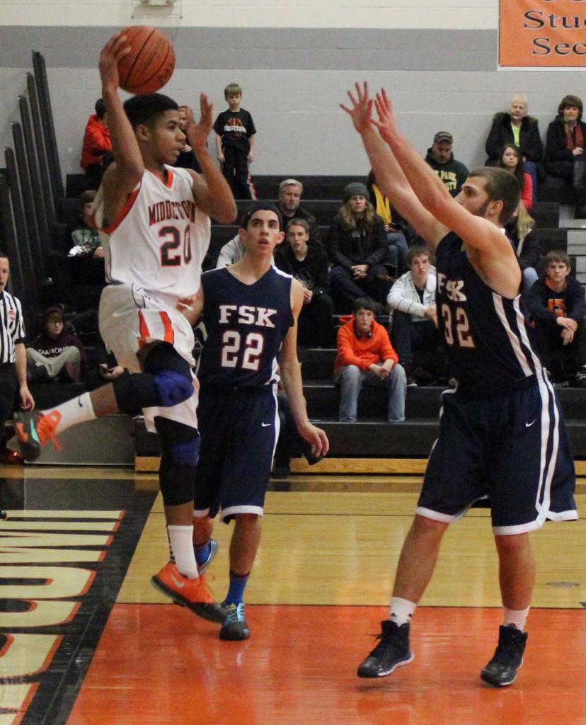 Knights junior Cedric Ayenu (#20) looks to pass the ball up court during the Knights 50-49 win over the FSK Eagles.