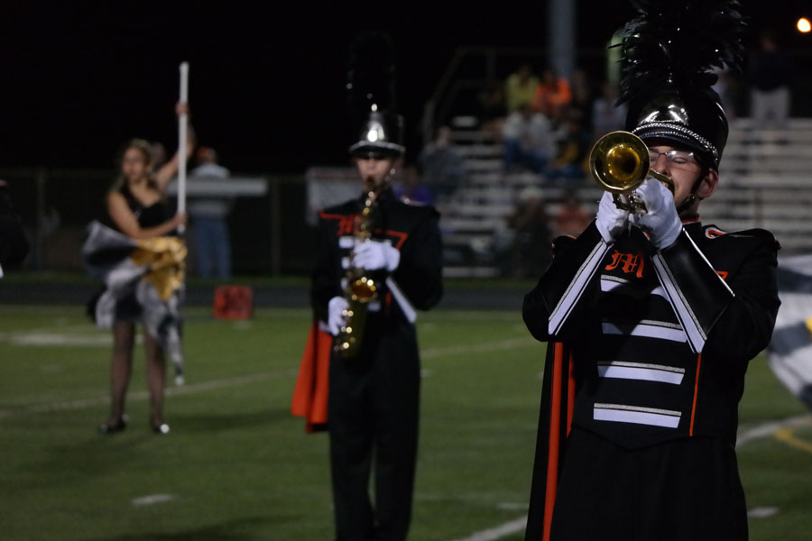 The MHS Marching Knights perform their half-time show at a home varsity football game against Winters Mill.