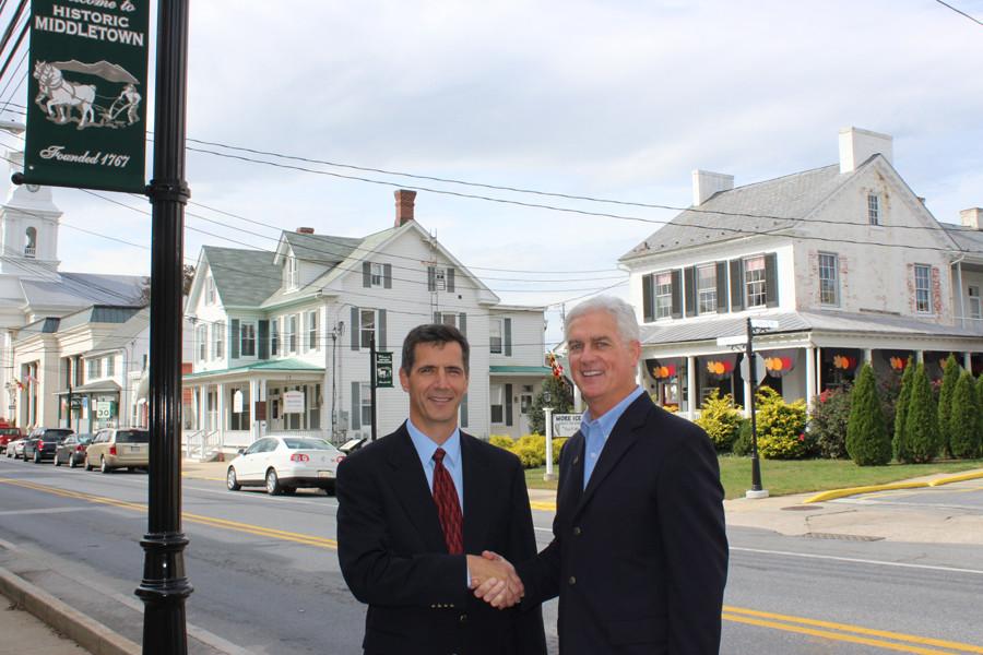Jerry Donald, left, and John Miller stand on Main Street in Middletown. Both Donald and Miller are social studies teachers at MHS and are elected officials.