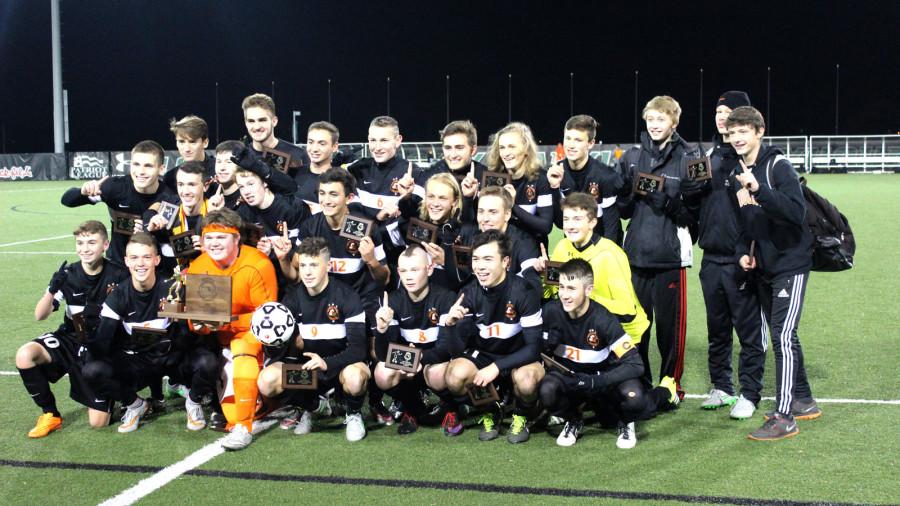 The Middletown boys varsity soccer team lines up for a quick group picture after their state championship win against La Plata. 