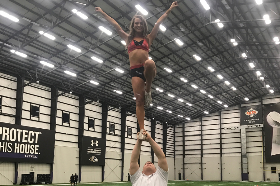 Couper+is+one+of+six+new+male+recruits+for+the+Baltimore+Ravens+cheer+team.+He+practices+stunts+twice+a+week+with+fellow+teammates+for+the+upcoming+season.+