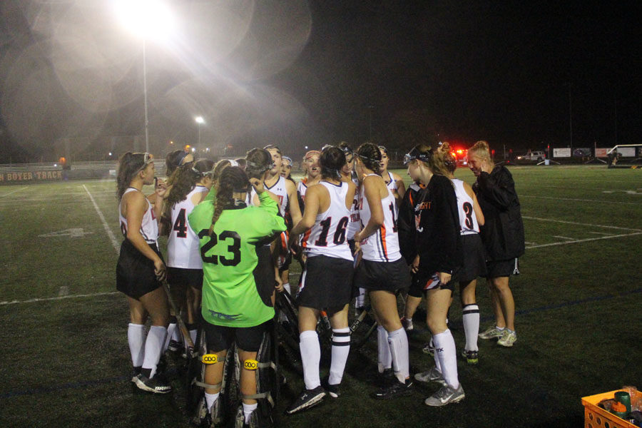 Knights players huddle during the game to discuss their strategy. 