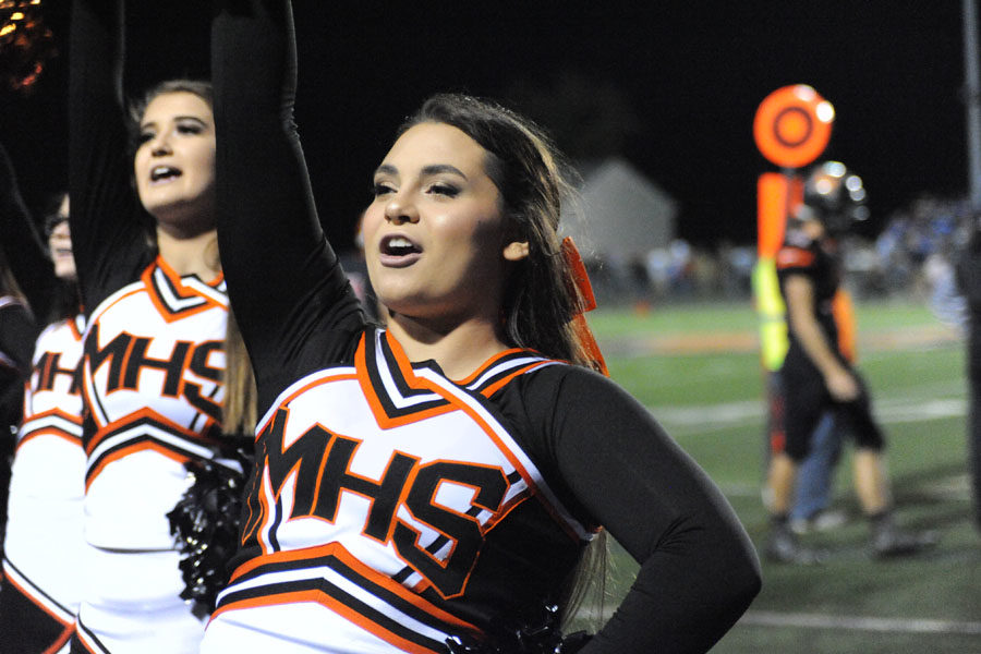 Senior Holly Scott cheers on the Knights during the game. 