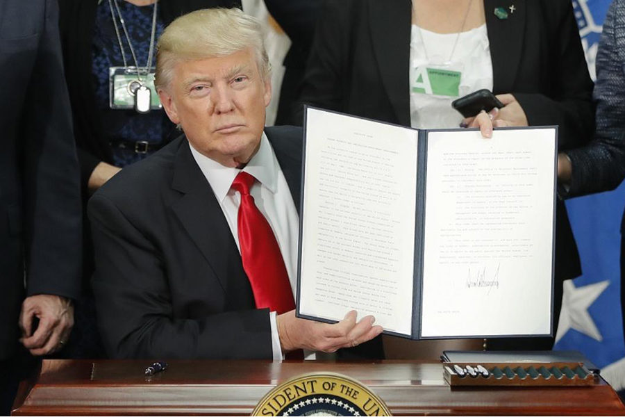 Donald Trump, finishing signing an executive order to give back the Predator Control Laws to Alaska. This executive order was overlooked when he announced that hunters would be allowed to kill elephants in Zimbabwe and bring them back as trophies.