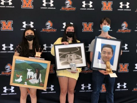 MHS students and winners of the art exhibition Rick Jenkins, Madelyn Baltrotsky, and Selma Depaz are holding their portraits.