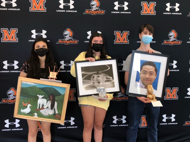 MHS+students+and+winners+of+the+art+exhibition+Rick+Jenkins%2C+Madelyn+Baltrotsky%2C+and+Selma+Depaz+are+holding+their+portraits.