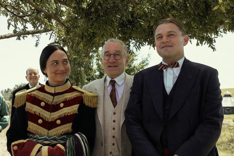 (From left to right) Lily Gladstone as Mollie Burkhart, Robert De Niro as William Hale, and Leonardo DiCaprio as Ernest Burkhart